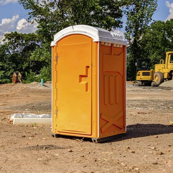 what is the cost difference between standard and deluxe portable restroom rentals in Alma